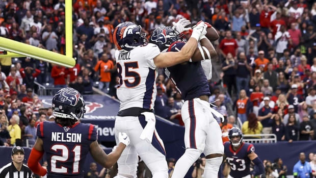 Houston Texans safety Jimmie Ward (1) intercepts a pass intended for Denver Broncos tight end Lucas Krull (85) in the final minute of the fourth quarter at NRG Stadium.